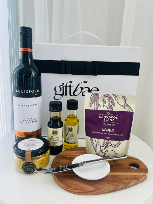 Gift bag with Beresford wine, olive oil, and olives on a white surface | Luxury gift hampers Australia – beautifully curated gourmet hampers, wine gift boxes, and pamper hampers for all budgets. Perfect for birthdays, anniversaries, corporate gifts & special occasions. Gift Bae offers Perth same-day delivery & Australia-wide shipping. Shop the best gift hampers online today!